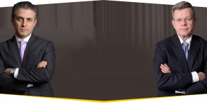 omrani and taub posing in front of a gray backdrop
