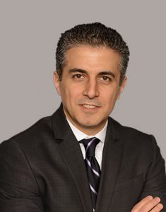 omrani in front of gray backdrop from omrani and taub
