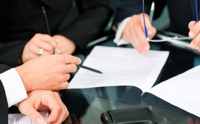 lawyers signing documents