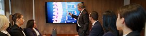 Michael Taub showing spinal injury to law team