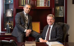 omrani and taub smiling in the office