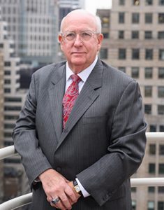 close up of james injury attorney at omrani and taub