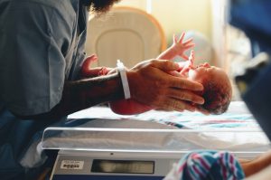 doctor holding a newborn