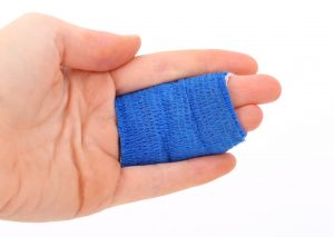 fingers wrapped in gauze bandage after fracture