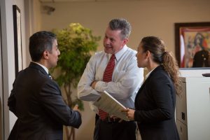 candid of omrani and taub discussing in the office accident case