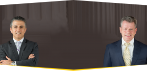Omrani and Taub attorneys spaced apart in font of a brown background