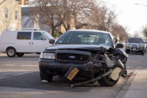 car with destroyed front from head on collision