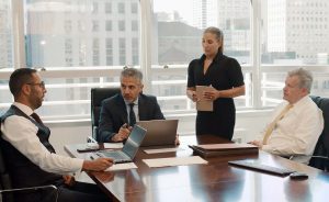 omrani and taub team discussing in meeting room