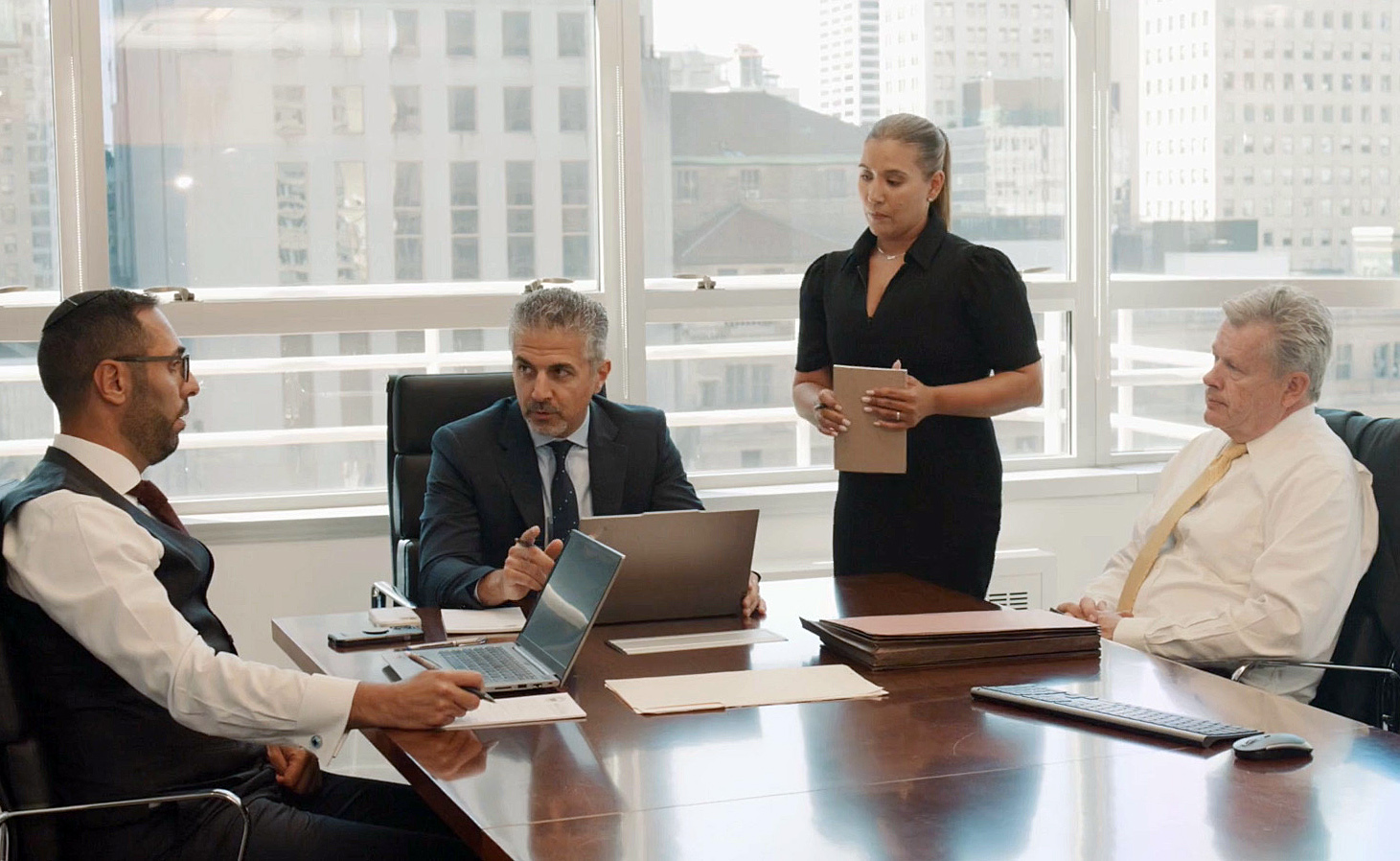 omrani and taub team discussing in meeting room