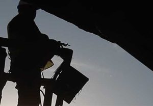 construction worker silhoutete on elevated lift