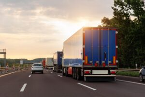 Commercial trucks on a highway, illustrating Trucks on the Parkway: Proving “Negligence Per Se” in NYC.