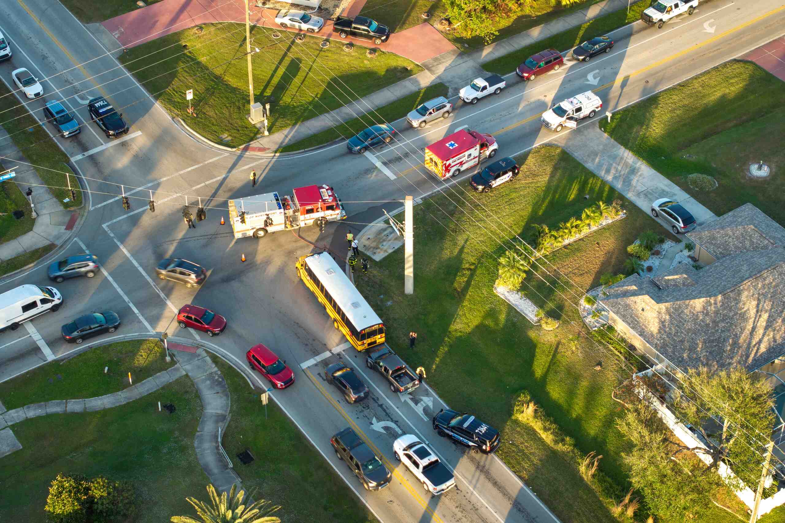 Aerial view of an accident scene involving a bus and emergency vehicles, relevant to Trucks on the Parkway: Proving “Negligence Per Se” in NYC.