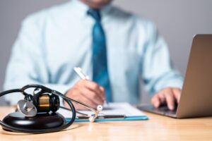 A New York pedestrian accident lawyer reviewing medical evidence and legal documents to secure compensation for injured clients.