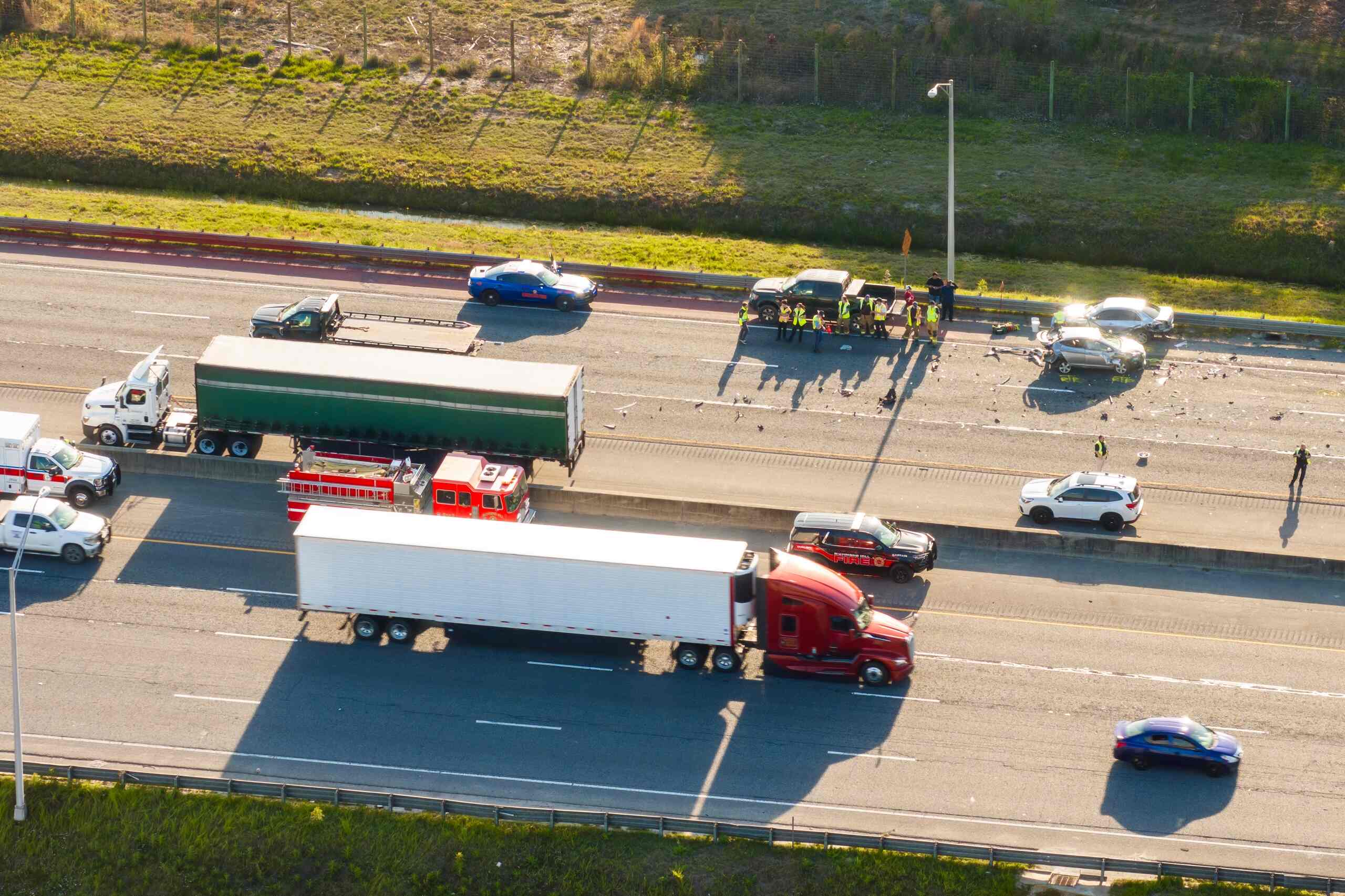 Aerial view of a major highway collision involving semi-trucks, highlighting the urgency of a "Spoliation Letter" to stop companies from wiping accident evidence in NYC.
