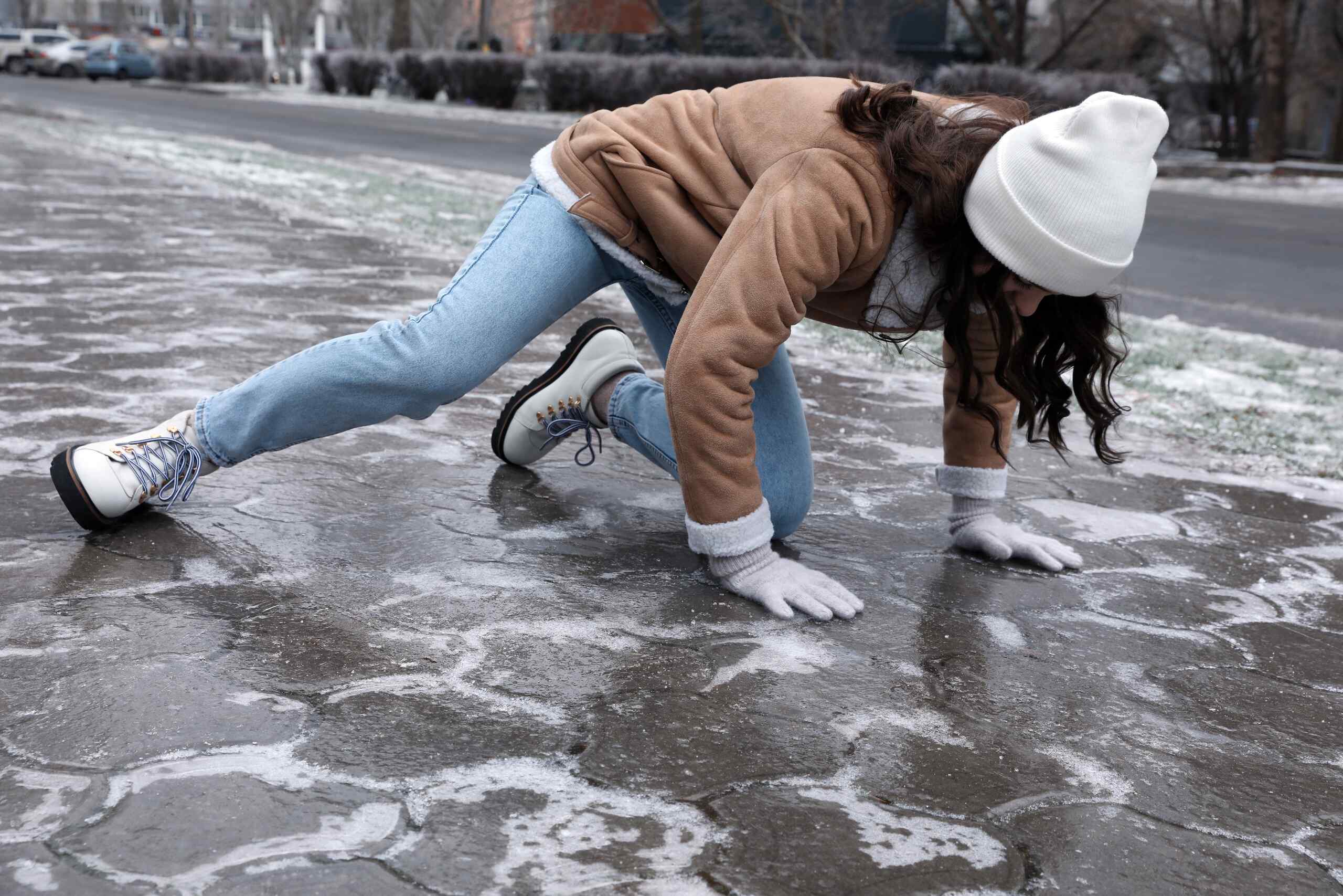 Person slipping on icy pavement while snow is still falling in NYC, example of when the storm in progress defense may apply.