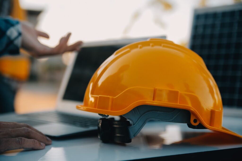 Yellow hard hat on a New York job site representing safety protocols and construction accident legal rights.