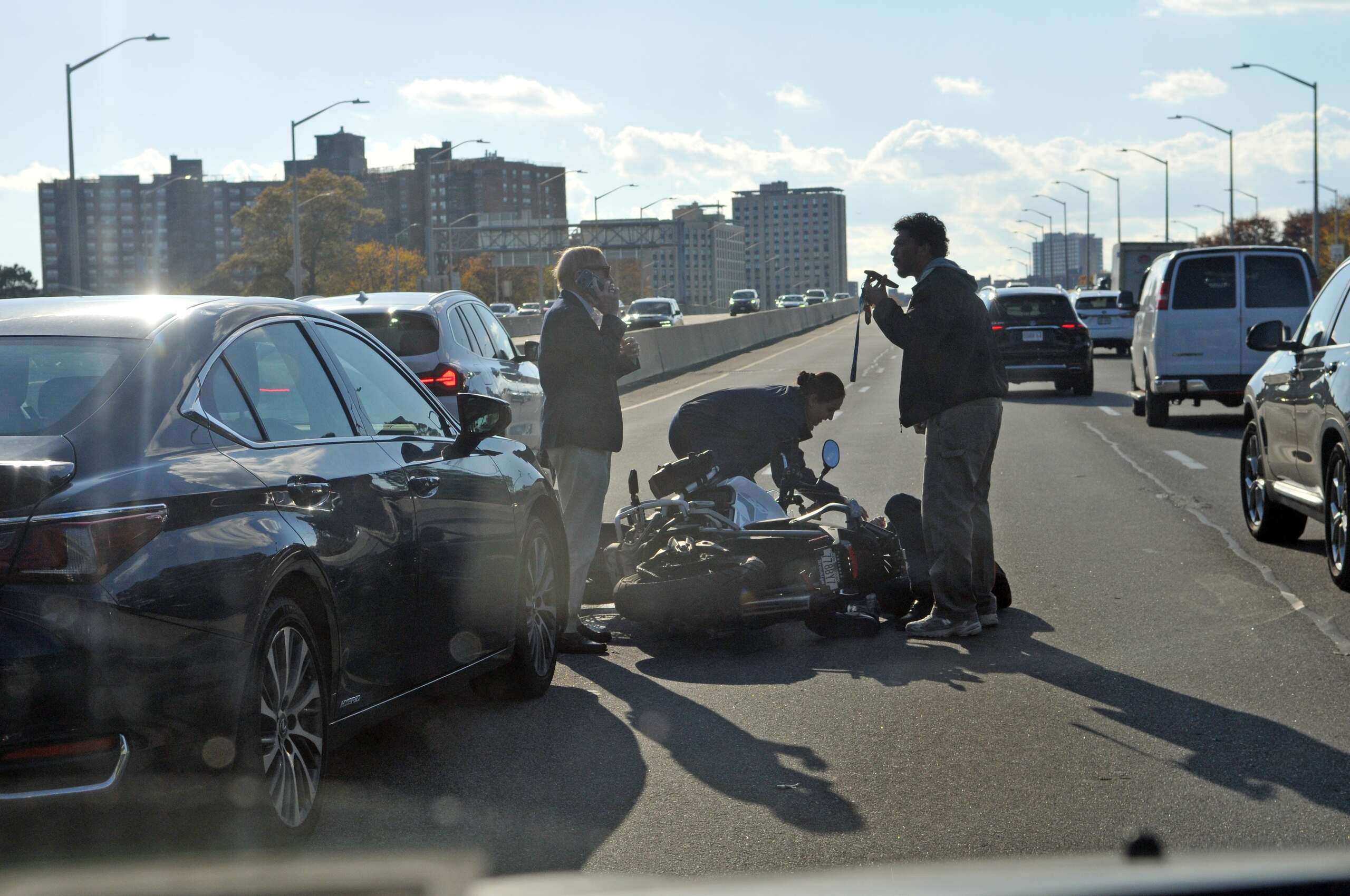Scene of a New York motorcycle crash on a busy highway where No-Fault medical coverage does not automatically apply.