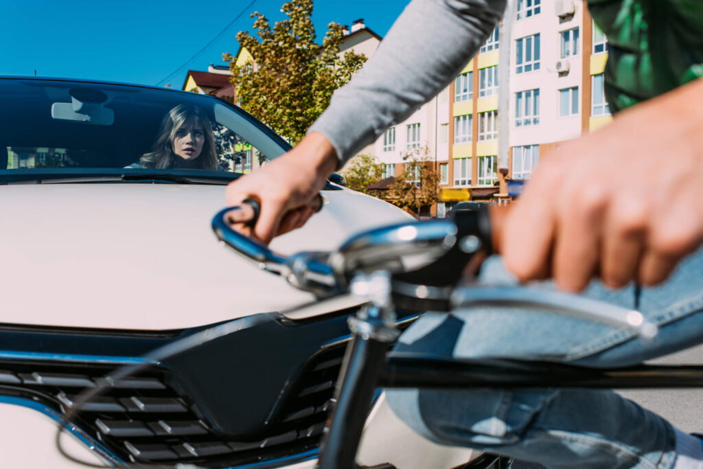 New York bicycle accident involving cyclist and vehicle at city intersection during daytime traffic conditions