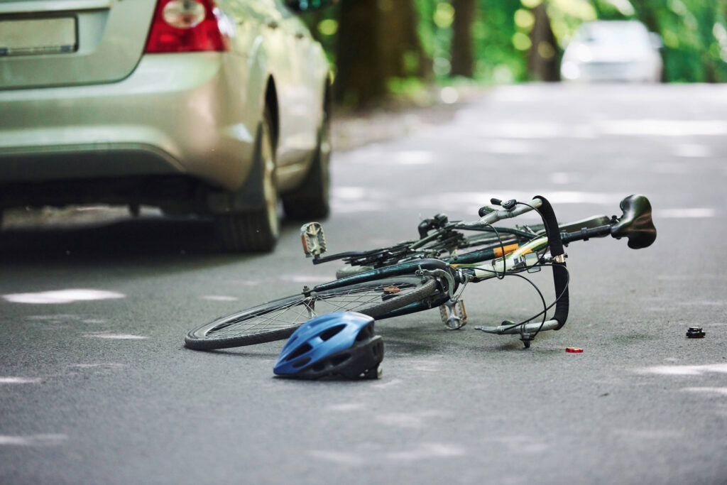 Bicycle dooring accident scene involving a cyclist injured after a car door opened into traffic in New York