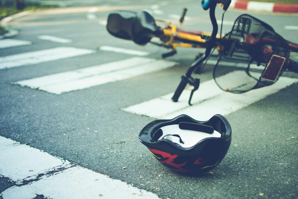 Bicycle helmet and damaged bicycle after a New York traffic accident involving no-fault medical bill claims