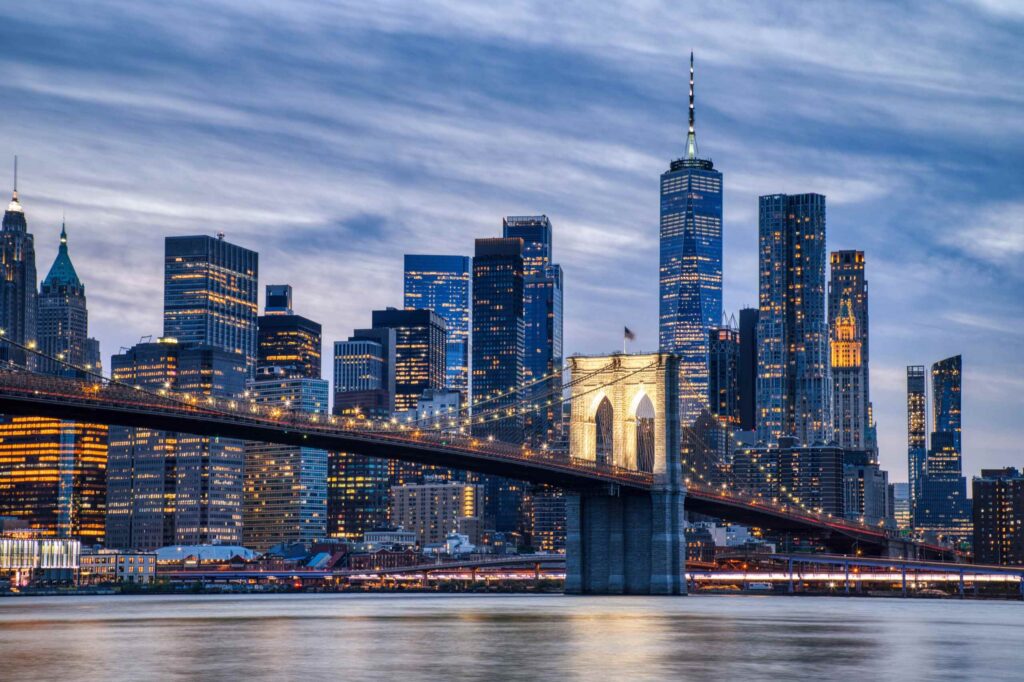 A New York Wrongful Death Lawyer represents families across the illuminated New York City skyline at night.