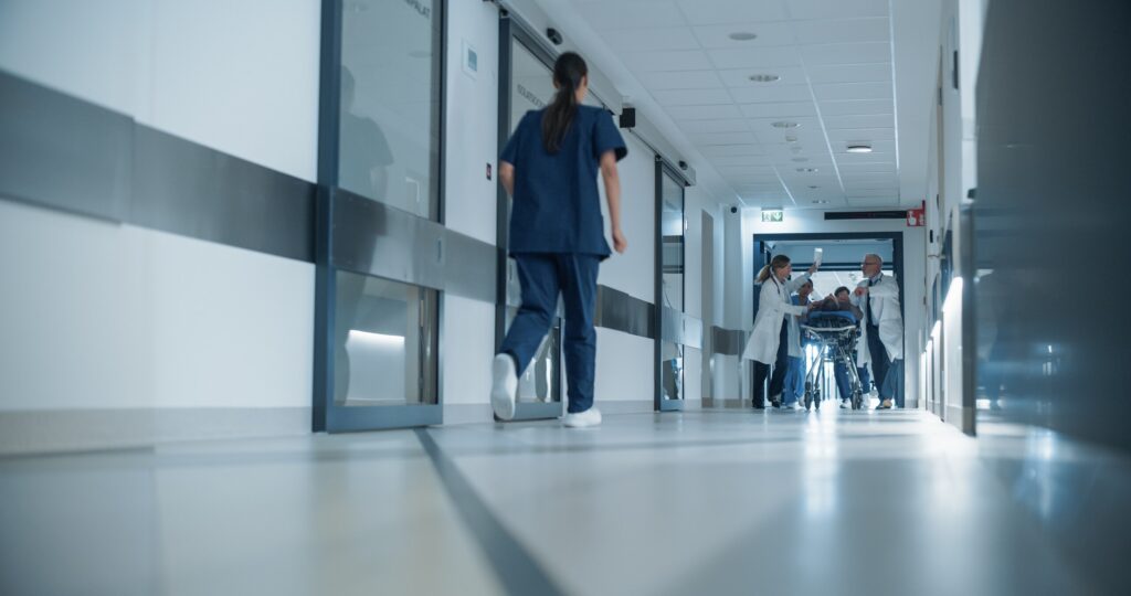 Medical staff rushing down a hospital hallway representing cases handled by a New York Wrongful Death Lawyer.