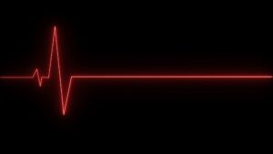 A flatline heartbeat monitor graphic represents the legal distinctions between a Wrongful Death vs. Survival Action in New York.