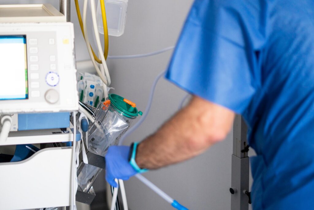 Medical staff adjusting equipment in a hospital reviewed by a New York medical malpractice lawyer.